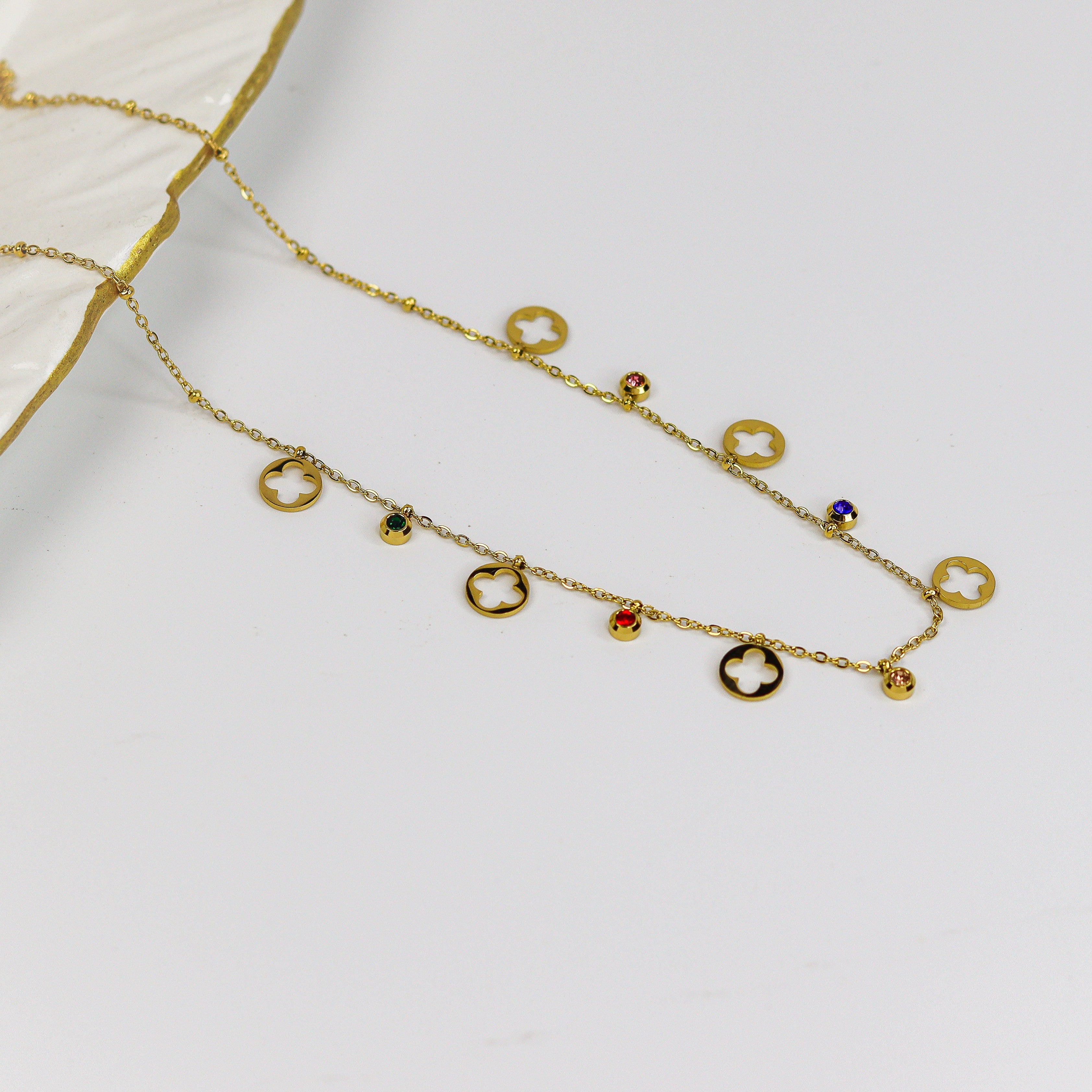Minimal gold chain with cutout clover discs and multi colour stone bead charms
