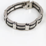 Silver and black bracelet on a white background