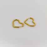 Gold heart-shaped earrings on a white background