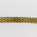Gold bracelet on a white background