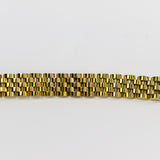 Gold bracelet on a white background