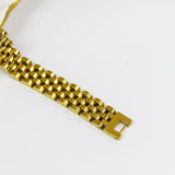 Gold watch strap on a white background