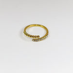 Gold ring with small stones on a white background